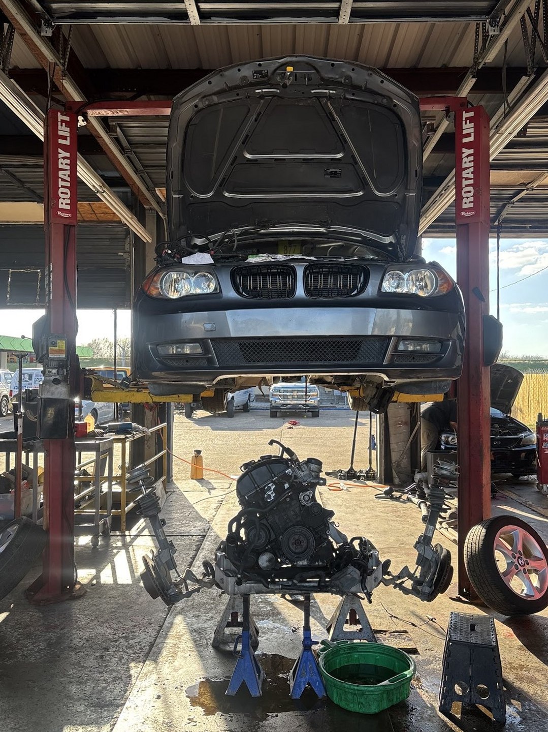 Vehicle on the lift with the engine accessible for diagnostics