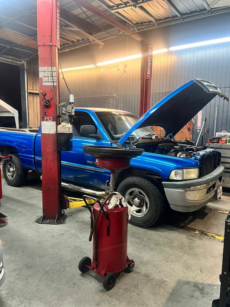 Vehicle on the lift for an oil service at Car Time Automotive
