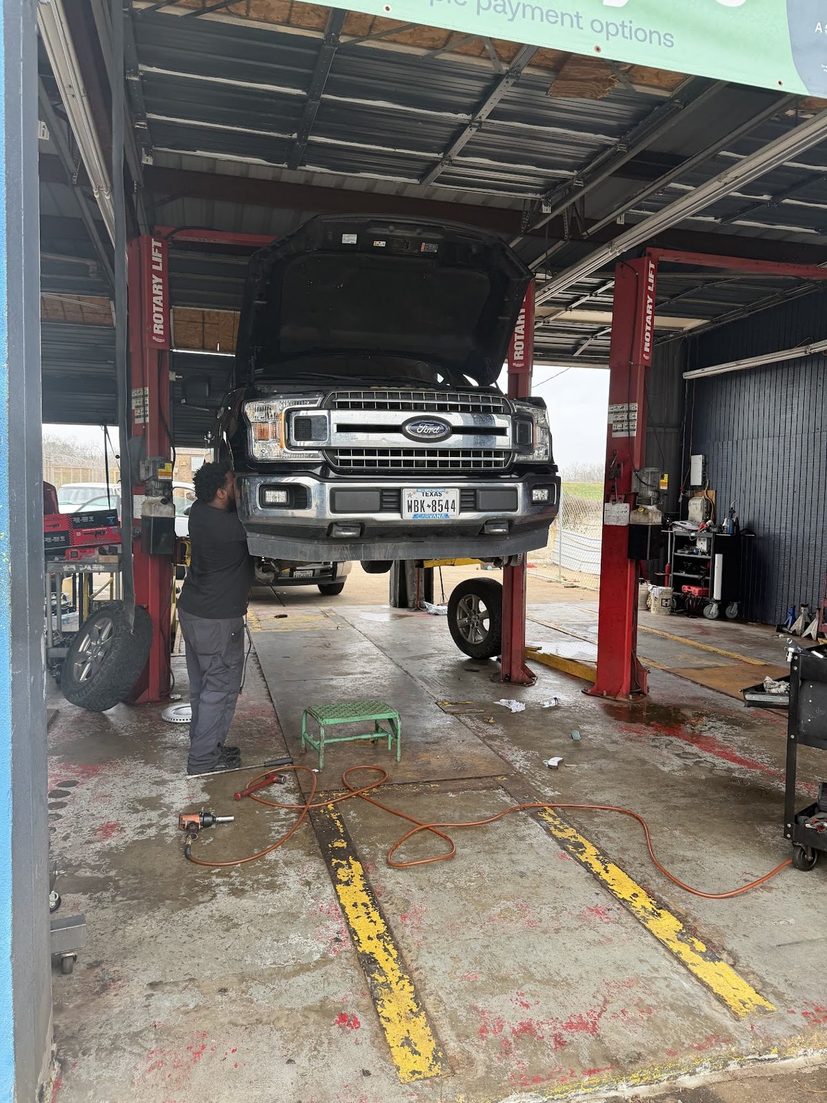 Pickup truck on the lift at Car Time Automotive